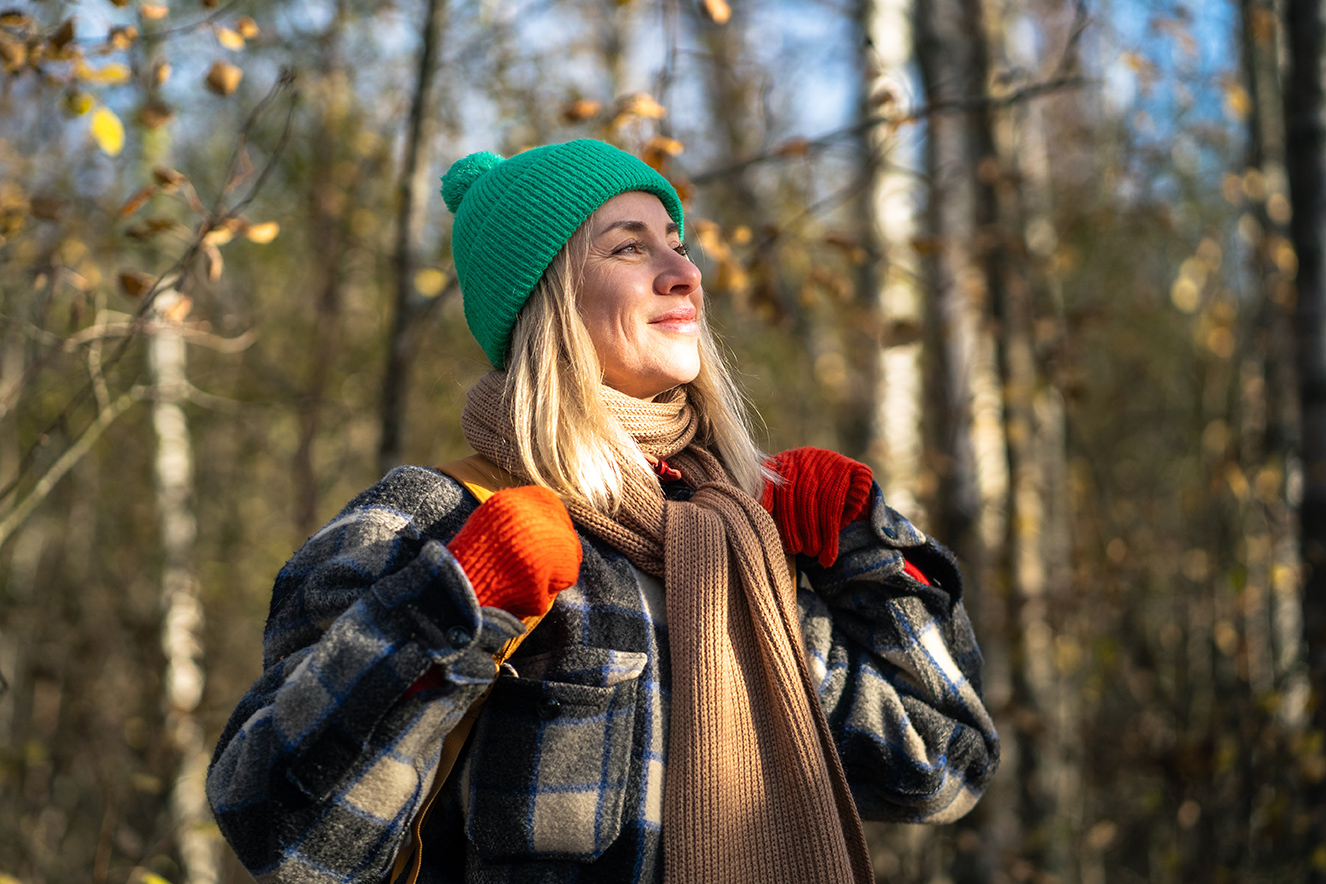 Happy woman outside in woods